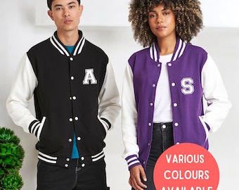 May include: Two varsity jackets, one black with white sleeves and the letter "A" on the chest, and one purple with white sleeves and the letter "S" on the chest.  VARIOUS COLOURS AVAILABLE.