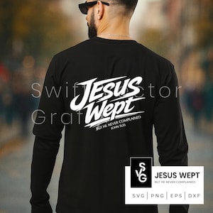 May include: Black long-sleeve shirt with the text "JESUS WEPT" in white script. Below the text is the phrase "BUT HE NEVER COMPLAINED JOHN 11:35". A small graphic with the words "JESUS WEPT" is in the lower right corner.
