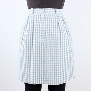 May include: A blue and white gingham skirt with a high waist and a pleated design.