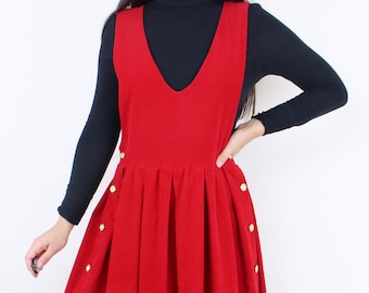 Vintage handmade red corduroy pinafore dress, bright, thin wale, sleeveless, v-neck, pleated skirt, gold side buttons, festive, Christmas