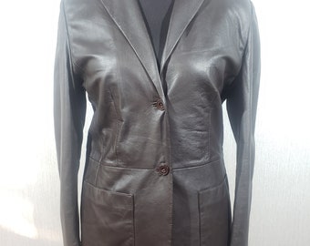 Wonderful brown women's genuine leather jacket. Classic women's leather jacket with buttons.