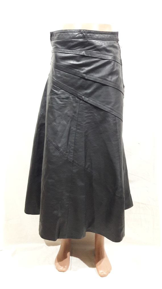 Solid flared leather skirt. Wide black skirt made