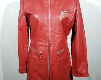 Stylish red women's leather raincoat. Cute women's leather jacket with metal zip.
