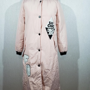 Reliable women&#39;s pink coat with synthetic insulation. Stylish long warm women&#39;s coat.