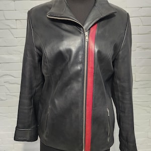 Women&#39;s black leather jacket with red inserts. Women&#39;s sports jacket with a zipper.