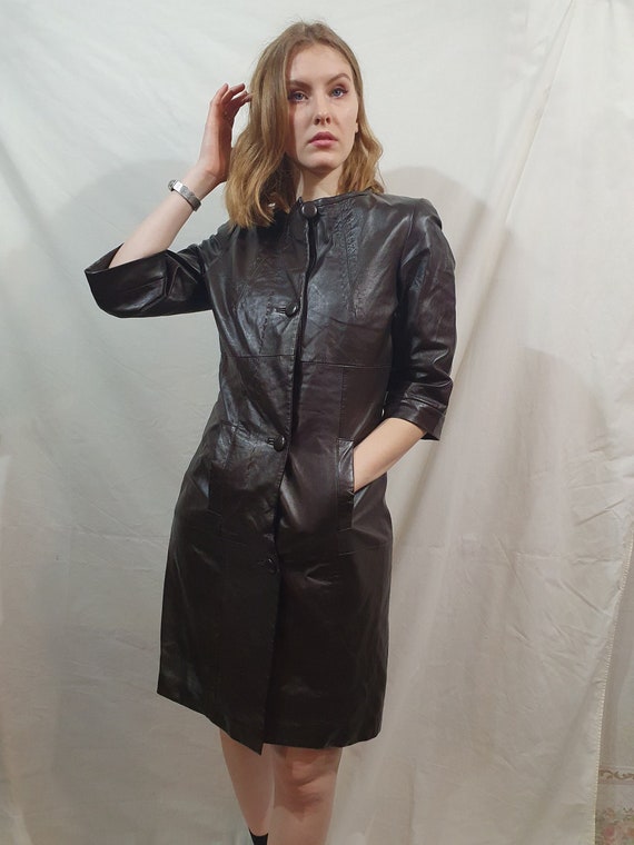 Delicate dress made of black genuine leather. Styl