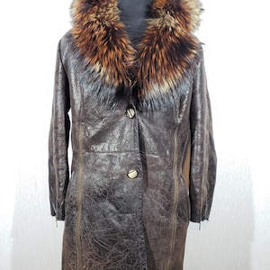 Stylish brown sheepskin coat with a warm fluffy collar. The sheepskin coat is made of wonderful warm sheep fur.