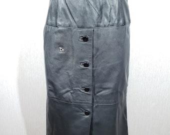 May include: A black leather skirt with a button-down front and a belt. The skirt is knee-length and has a classic, tailored design. The leather appears smooth and has a slight sheen.
