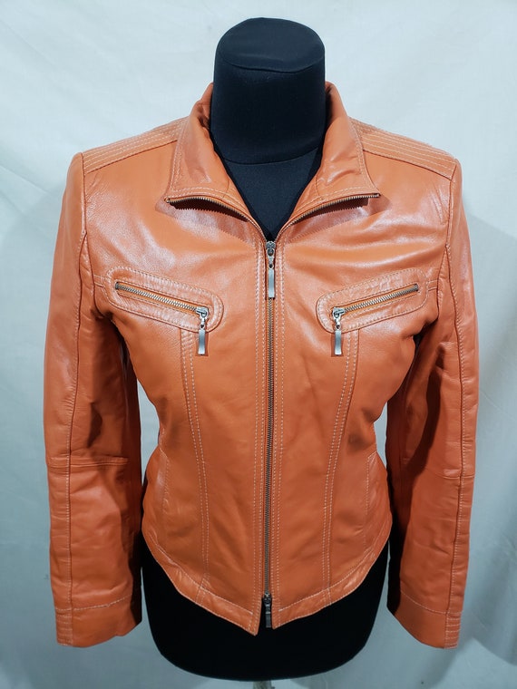 Delightful women's leather jacket. Delicate orange