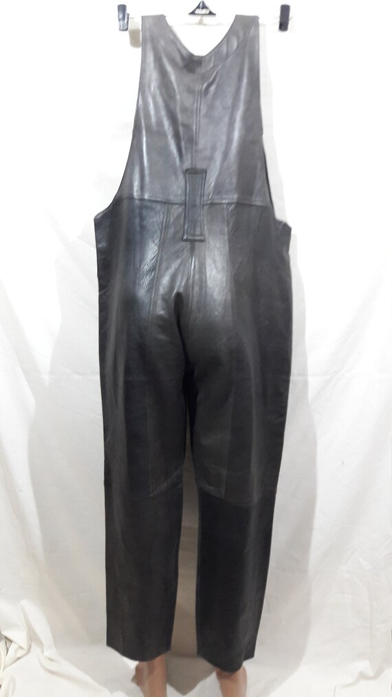 Simple reliable gray unisex leather jumpsuit. Unis