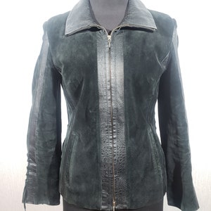 Wonderful women&#39;s leather jacket with a zipper. Black women&#39;s jacket with genuinel suede and leather inserts.
