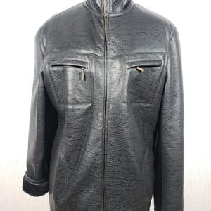 Men&#39;s black sheepskin coat with a metal zipper. Men&#39;s sheepskin coat with black sheepskin.