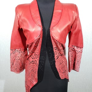 Stylish red women&#39;s leather jacket with perforated inserts. Interesting women&#39;s leather jacket.