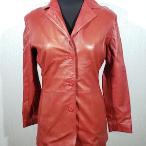 Stylish red women&#39;s leather jacket. Cute women&#39;s leather jacket.