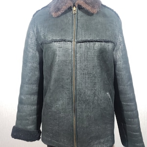 Men&#39;s black sheepskin coat with a fluffy collar. Reliable men&#39;s sheepskin coat with a zipper.