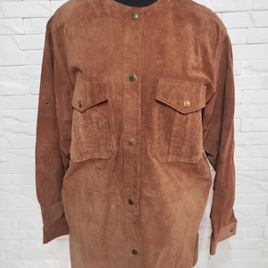Stylish women&#39;s shirt made of genuine suede. Brown women&#39;s shirt made of genuine leather.