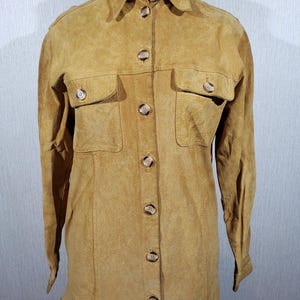 Stylish women&#39;s shirt made of genuine suede. Brown women&#39;s shirt made of genuine leather.
