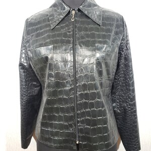 Stylish women&#39;s black faux leather jacket. Reliable women&#39;s black jacket with a zipper.