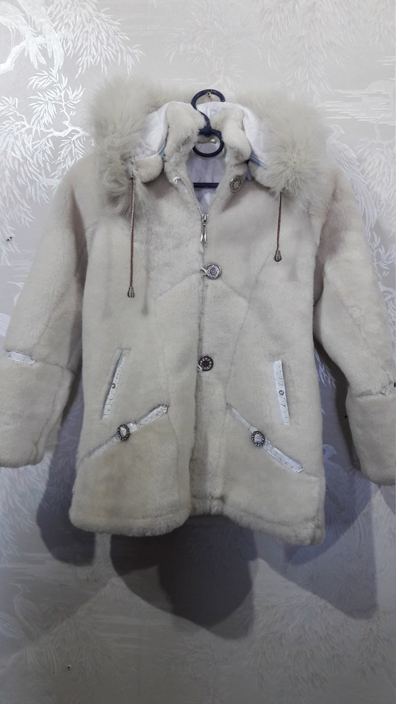 Cute children's sheepskin coat. Beige children's s