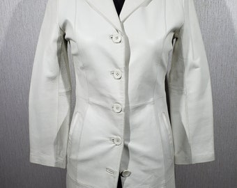 Cute long women's leather jacket with buttons. Stylish white jacket made of genuine leather.