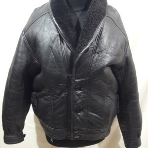Gorgeous men&#39;s black sheepskin coat with buttons. Men&#39;s sheepskin coat with black fur.