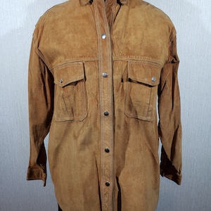 Stylish women&#39;s shirt made of genuine suede. Brown women&#39;s shirt made of genuine leather.