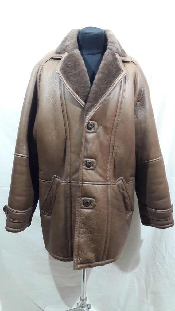 Warm reliable men's sheepskin coat made of natural