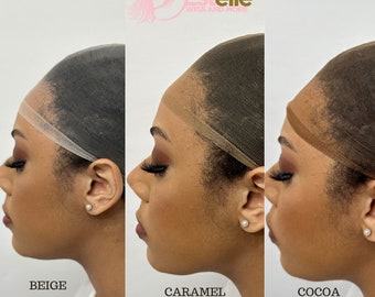 May include: Three wig caps in different shades of brown: beige, caramel, and cocoa. The caps are made of a fine mesh material and are designed to fit snugly on the head. Estelle Wigs and More.