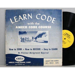 May include: A blue and white record album cover with the text "LEARN CODE with the AMECO CODE COURSE". The cover features a photo of a hand operating a telegraph key. The text "How to SEND How to RECEIVE Easy to LEARN No Previous Background Required" is printed below the photo. The bottom of the cover has the text "AMECO PUBLISHING CORP. DISTRIBUTED BY AMECO EQUIPMENT CORP." and "JUNIOR CODE COURSE CAT. # 100-33 $4.95".