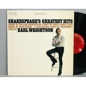 May include: Vintage vinyl record album cover for "Shakespeare's Greatest Hits" featuring Earl Wrightson. The cover has text in black and red, with a photo of Wrightson. A black vinyl record is visible.