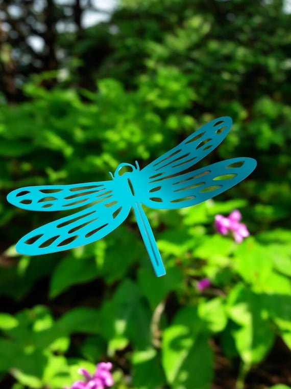 Dragon fly wall art. Made out of heavy 16 gauge steel Finished with a Teal industrial oven baked powder coated finish.