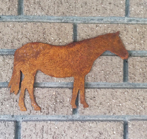 Rusty Horse wall art. Made out of 18 gauge steel. Has sawtooth Hanger welded on the back. Had a rust patina for a rustic look.
