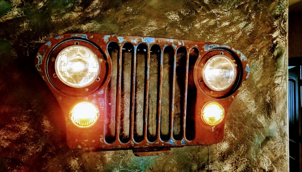 Original Jeep Grill wall art. Working head and park lights great for