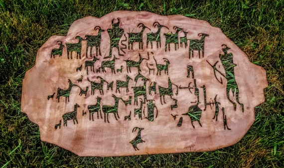 The great hunt. Steel reproduction of the great hunt petroglyph. copper patina.