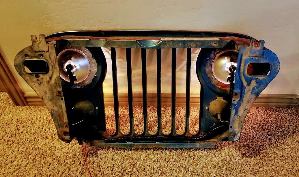 Original Jeep Grill wall art. Working head and park lights great for