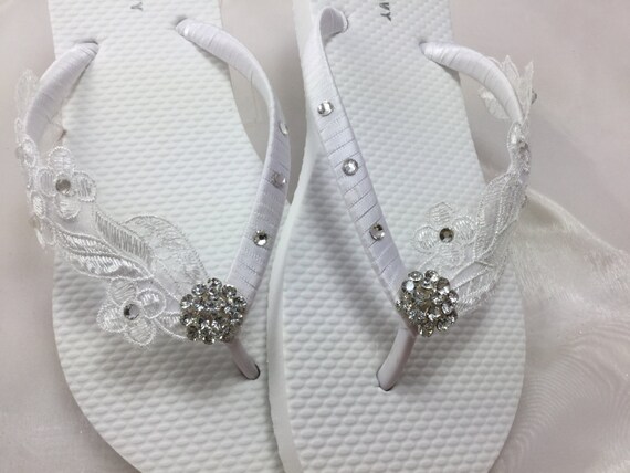 white flip flops with rhinestones