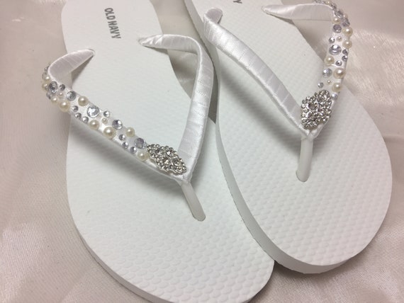 white pearl flip flops