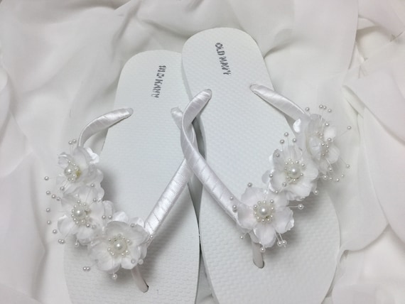 white flower flip flops
