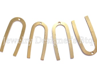May include: Four gold metal U-shaped charms with a hole at the top. The charms are approximately 1.5 inches tall.