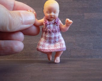 1:6 DOLL dressed in a hand knitted gingham pinafore by Angela Turner