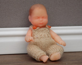 1:12 3D printed newborn doll's house doll in a hand knitted pair of dungarees