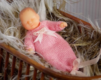 1:12 3D printed new born baby doll for the doll's house wearing a pink gown by Angela Turner