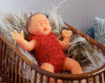 1:6 DOLL dressed in a hand knitted romper using merino yarn