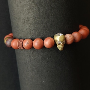Crystal Skull Frosted red Fossil stone and brass bead