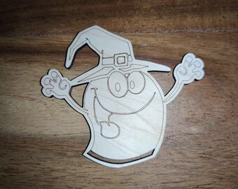 May include: A wooden cutout of a smiling ghost wearing a witch's hat. The ghost has large eyes and a wide grin. The hat has a buckle and a brim.