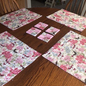 It’s Spring Time with these lovely flower and butterflies print (reversible to a butterfly quilt pattern). Coasters to match also reversible
