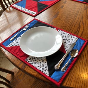 Red, black blue Unique quilted and reversible placemats with matching coasters  Sold as a set