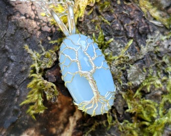 Tree pendant with a blue opal gemstone