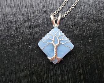 Tree pendant with a blue opal gemstone