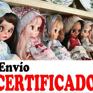 May include: A row of six dolls with different skin tones and hair colors wearing vintage-style dresses and bonnets. The dolls are sitting on a shelf with a white background. The text "Envio CERTIFICADO" is visible in the bottom of the image.